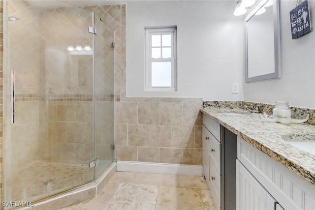 bathroom with vanity and an enclosed shower