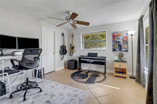 tiled office featuring ceiling fan