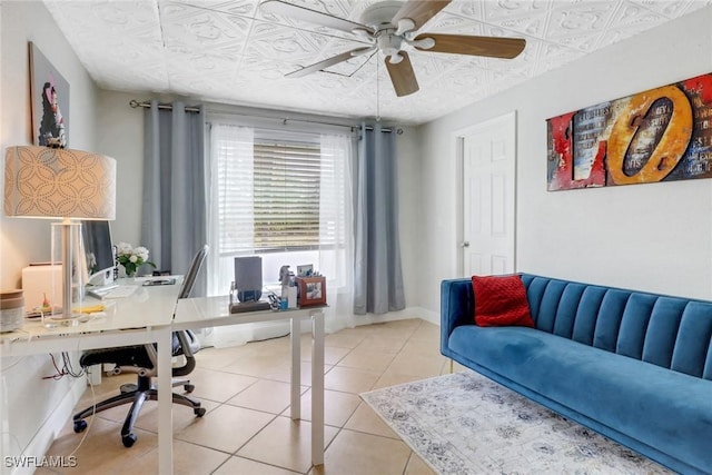 tiled office featuring ceiling fan