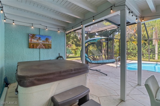 sunroom featuring plenty of natural light and beamed ceiling