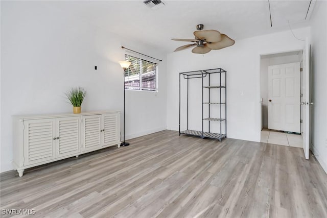 interior space with light hardwood / wood-style floors and ceiling fan