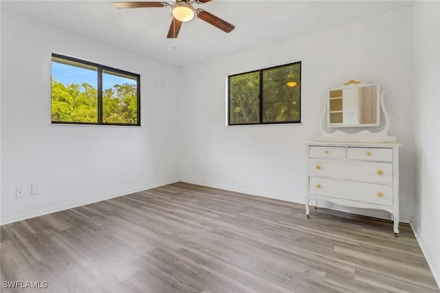 interior space with ceiling fan and light wood-type flooring