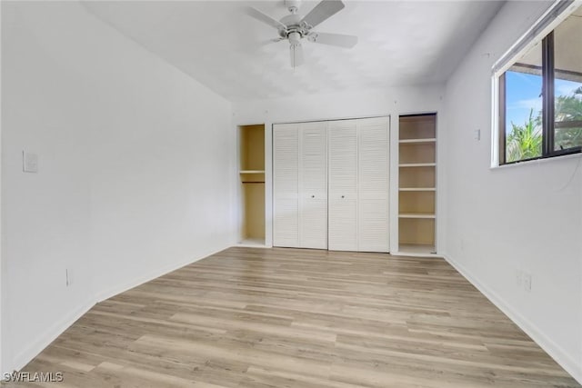 unfurnished bedroom featuring ceiling fan, a closet, and light hardwood / wood-style floors