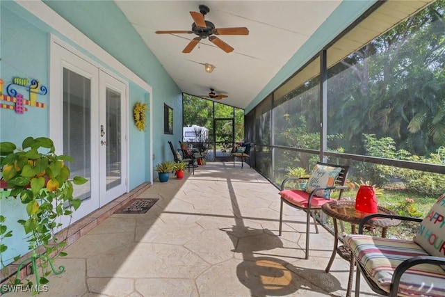 sunroom / solarium with french doors, ceiling fan, and lofted ceiling