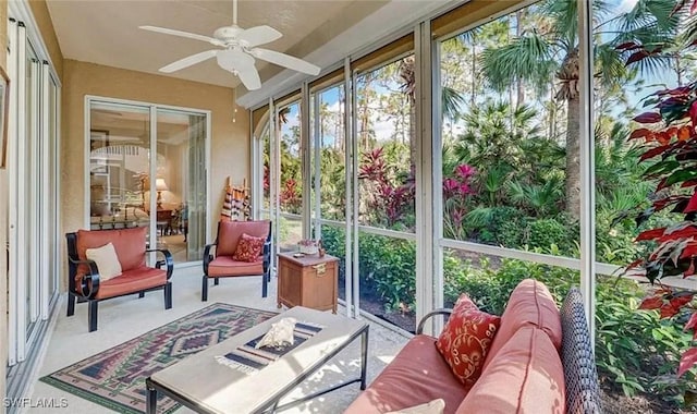 sunroom / solarium featuring ceiling fan