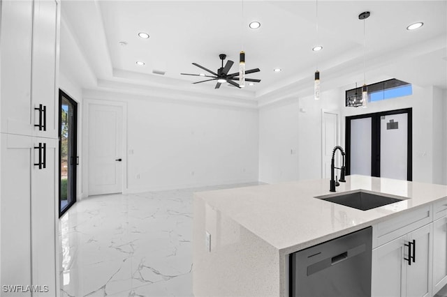 kitchen with white cabinetry, sink, light stone counters, stainless steel dishwasher, and pendant lighting