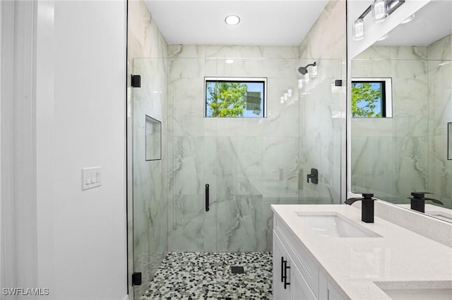 bathroom featuring vanity and walk in shower