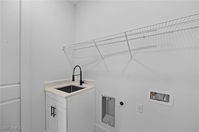 laundry room featuring cabinets, hookup for a washing machine, electric dryer hookup, and sink