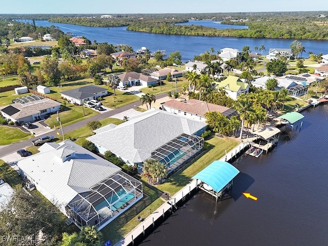 aerial view featuring a water view and a residential view