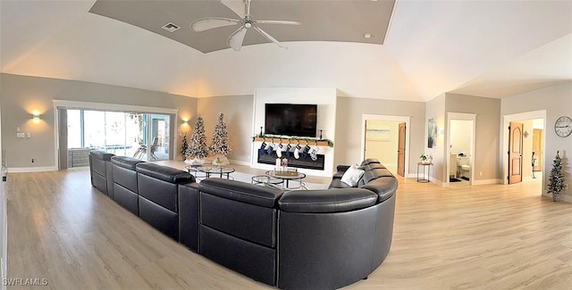 living room featuring light wood-type flooring, high vaulted ceiling, and ceiling fan