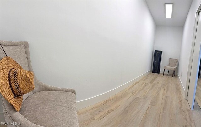 interior space featuring light wood-style floors and baseboards