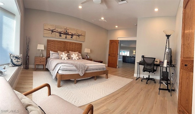 bedroom with lofted ceiling, light wood finished floors, visible vents, and recessed lighting