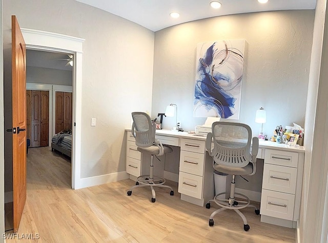 office space featuring baseboards, recessed lighting, and light wood-style floors