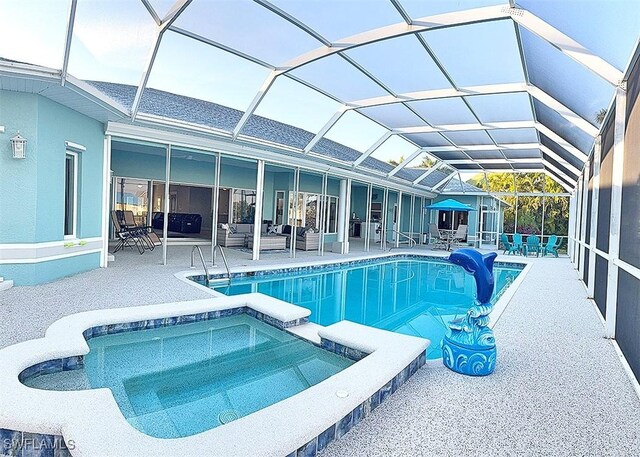 view of swimming pool featuring outdoor lounge area, glass enclosure, an in ground hot tub, and a patio