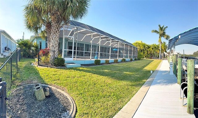 exterior space featuring glass enclosure and fence