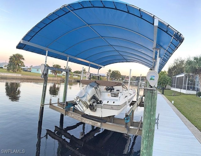 view of dock featuring a water view and boat lift