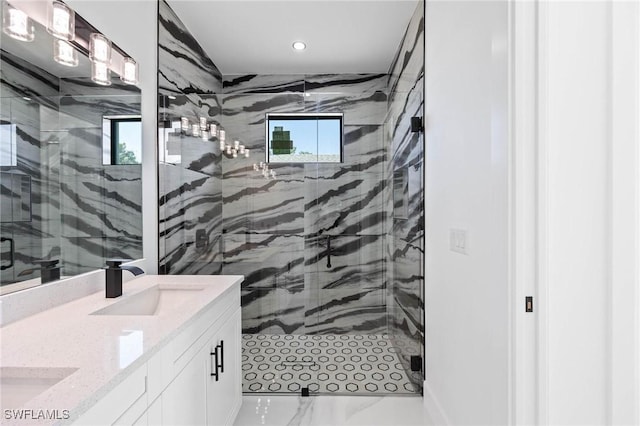 bathroom featuring vanity and an enclosed shower