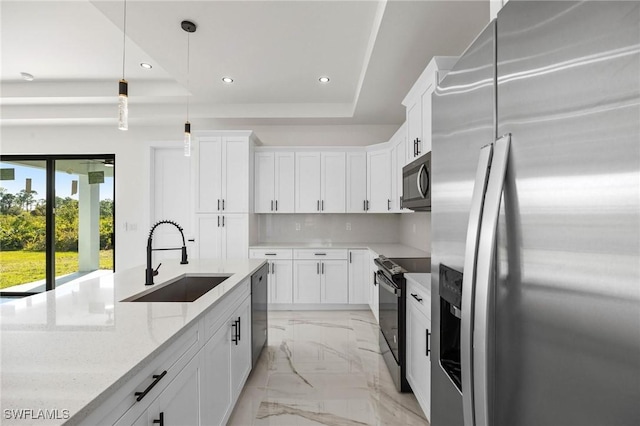 kitchen with sink, white cabinets, and stainless steel appliances