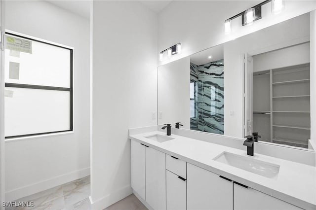 bathroom featuring vanity and a tile shower