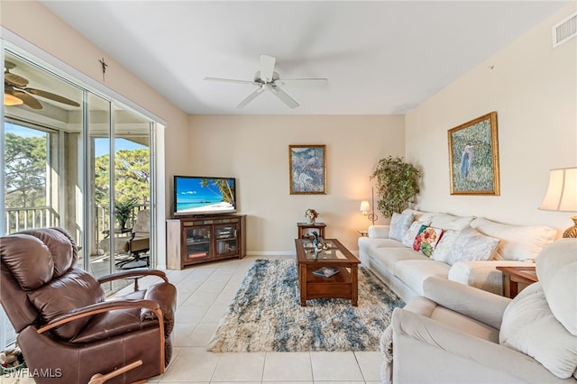 tiled living room featuring ceiling fan