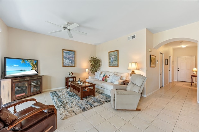 tiled living room featuring ceiling fan