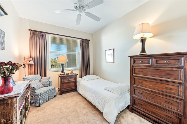 bedroom with ceiling fan and light carpet