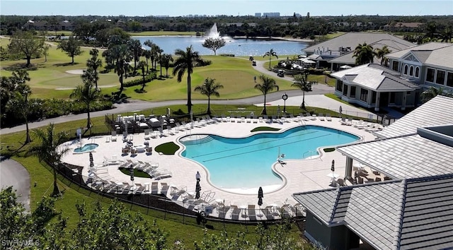 view of swimming pool with a water view