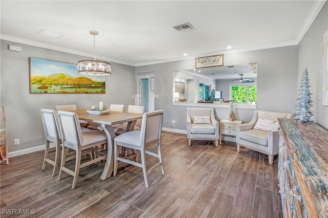 dining area with crown molding, ceiling fan, and hardwood / wood-style flooring