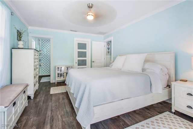 bedroom with ceiling fan, dark hardwood / wood-style floors, and crown molding