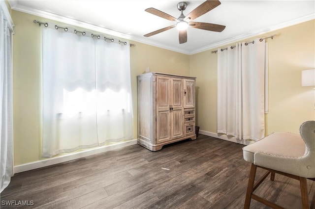 interior space featuring dark hardwood / wood-style floors, ceiling fan, and crown molding