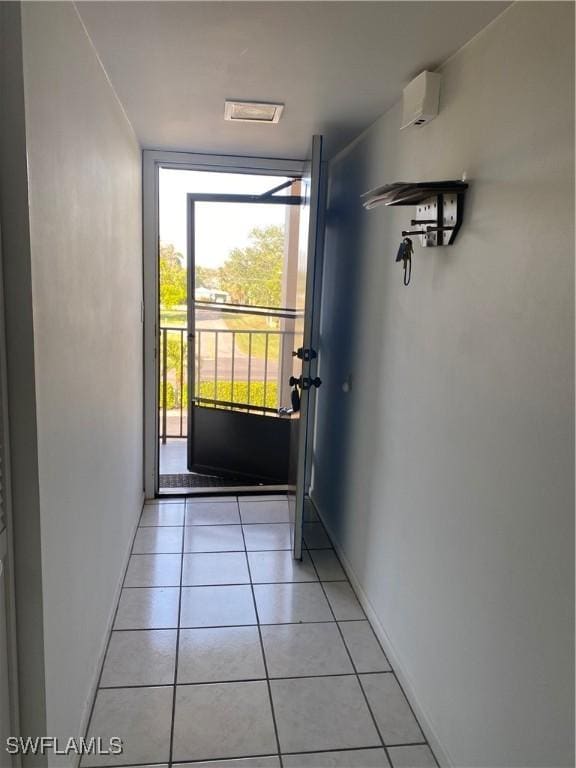 doorway to outside featuring light tile patterned floors