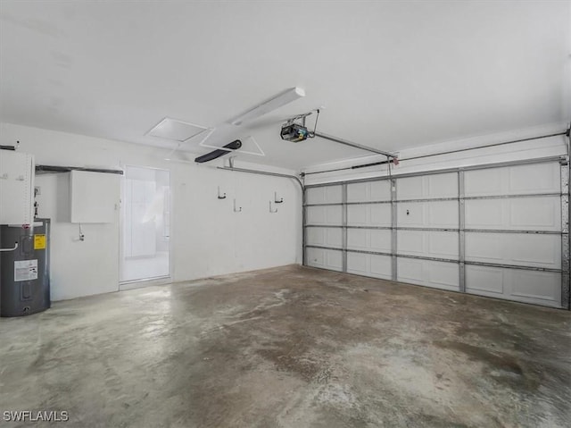 garage with water heater and a garage door opener