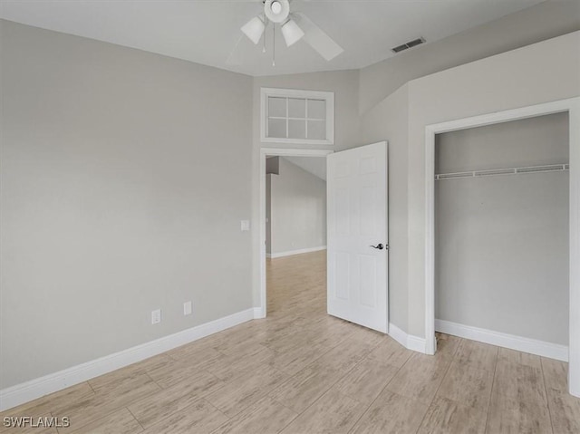 unfurnished bedroom with ceiling fan, a closet, and light hardwood / wood-style flooring