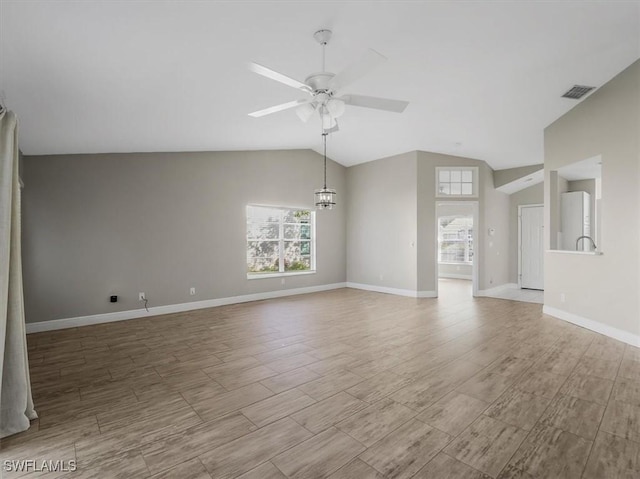 unfurnished living room featuring ceiling fan, light hardwood / wood-style floors, and lofted ceiling