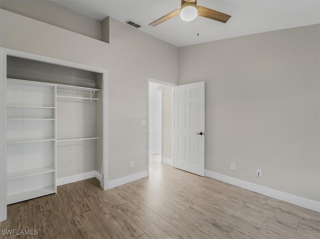 unfurnished bedroom featuring light wood-type flooring, a closet, and ceiling fan