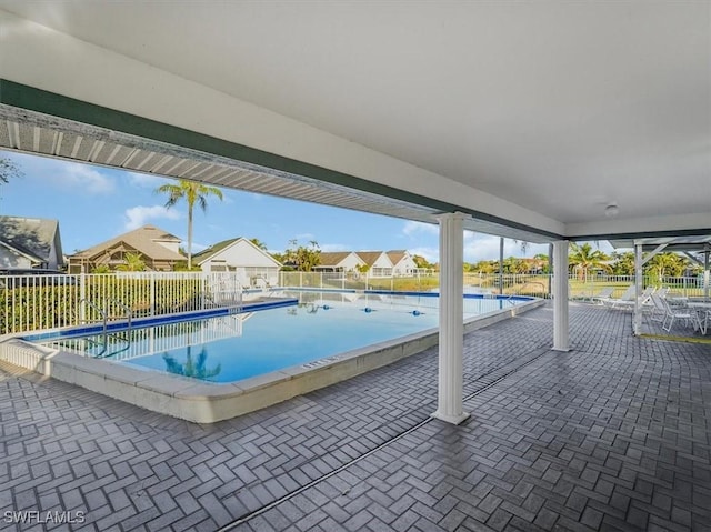 view of swimming pool featuring a patio area