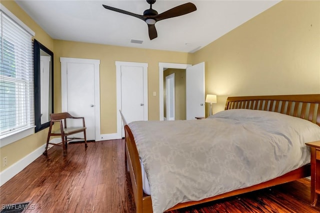 bedroom featuring ceiling fan and dark wood-type flooring