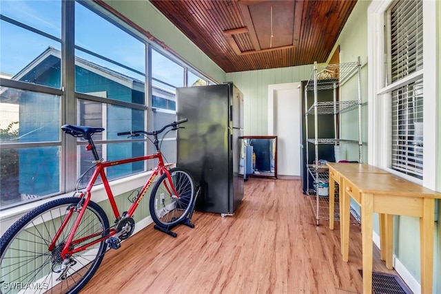 interior space with hardwood / wood-style flooring and wood ceiling