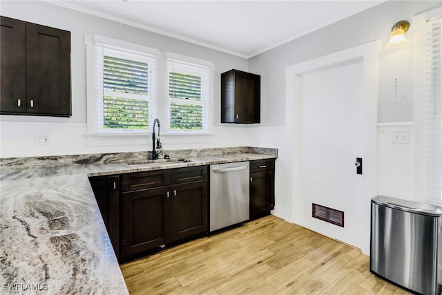 kitchen featuring sink, stainless steel dishwasher, light stone countertops, dark brown cabinets, and light hardwood / wood-style floors