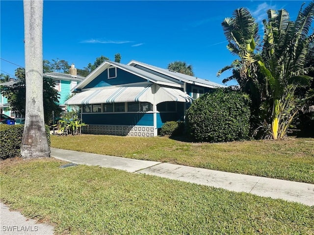 bungalow with a front lawn