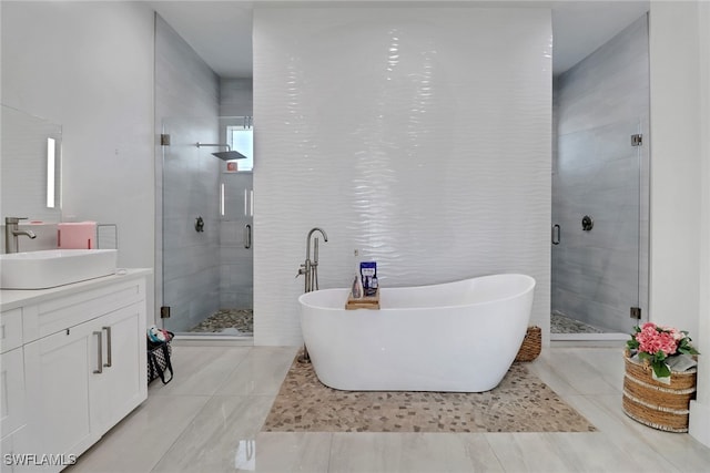 bathroom with vanity and independent shower and bath