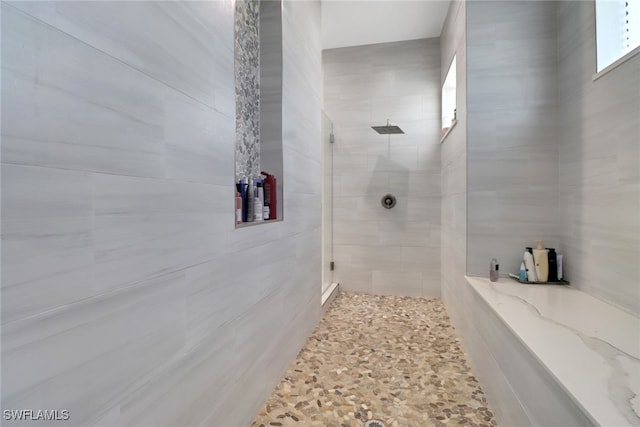 bathroom with tiled shower