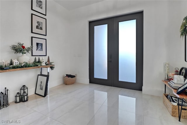 entrance foyer with french doors and light tile patterned flooring