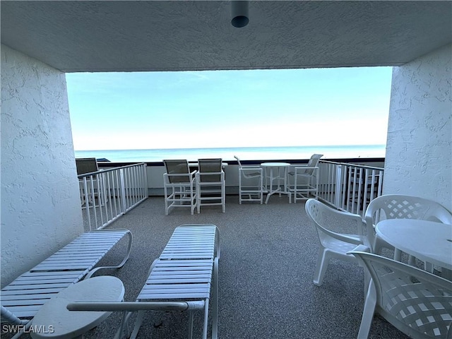 balcony featuring a water view