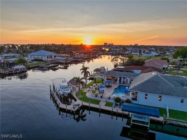 aerial view at dusk with a water view