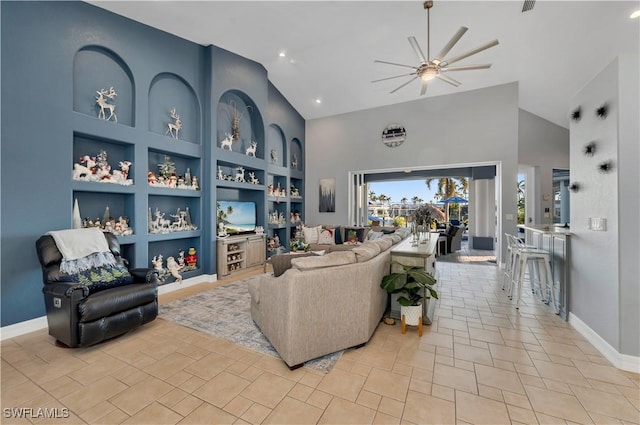 tiled living room featuring high vaulted ceiling, built in features, and ceiling fan