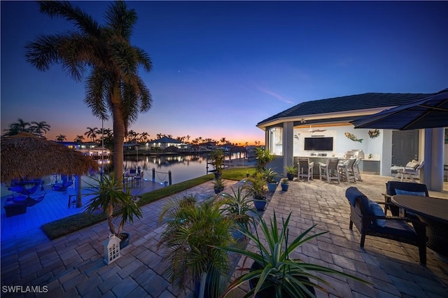 patio terrace at dusk with an outdoor bar