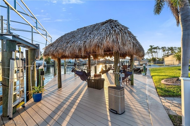 dock area featuring a yard and a water view