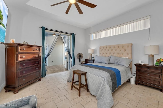 tiled bedroom featuring ceiling fan