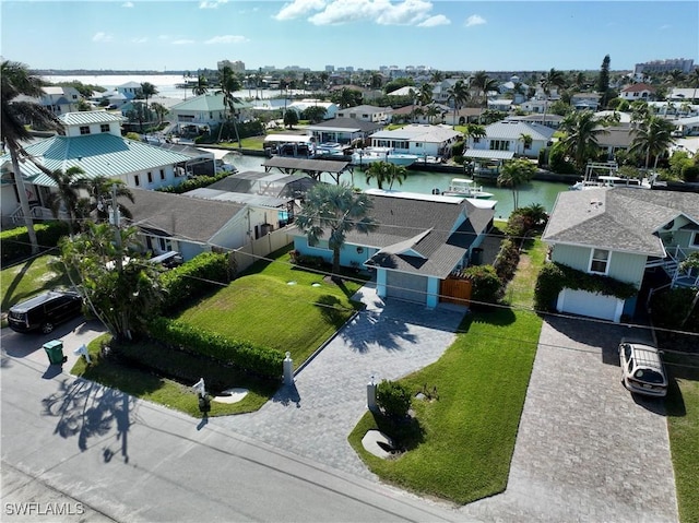 birds eye view of property featuring a water view